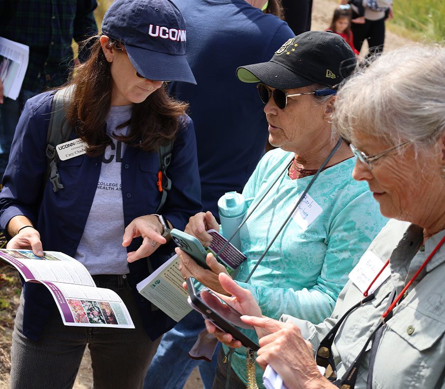 Extension Faculty showing a geospatial training participant a phone app